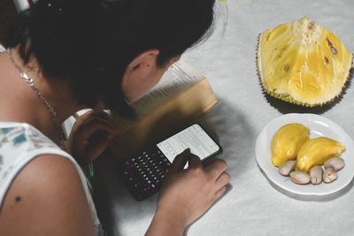 High angle view of woman preparing food