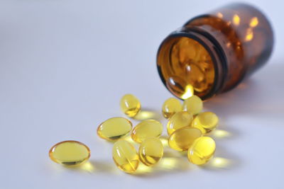 Close-up of yellow bottle on table