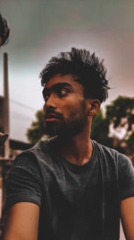 Portrait of young man looking away