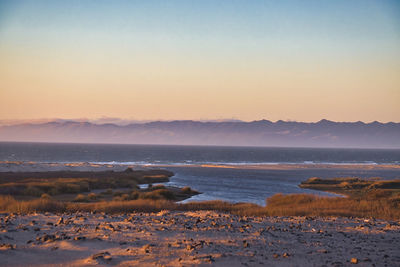 Scenic view of sea against sky during sunset