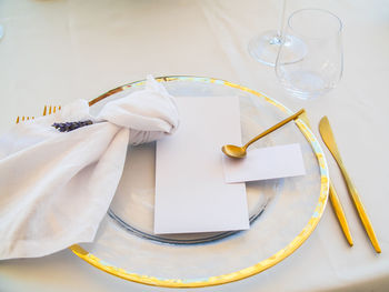 High angle view of wedding rings on table