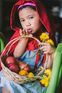 Portrait of a girl holding basket
