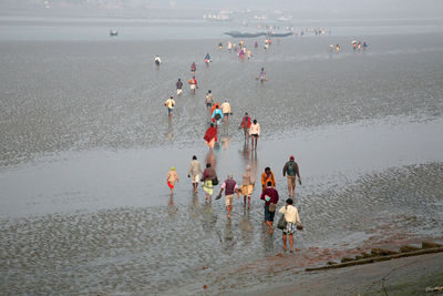 People enjoying at beach
