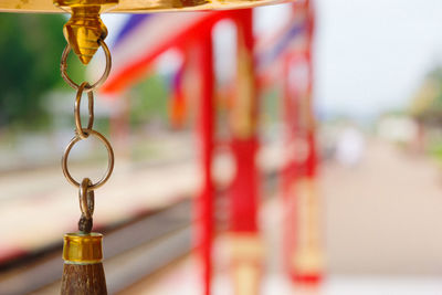 Close-up of chain hanging on bell