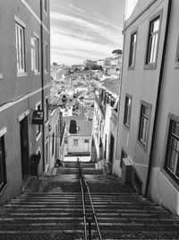 Street amidst buildings in town against sky