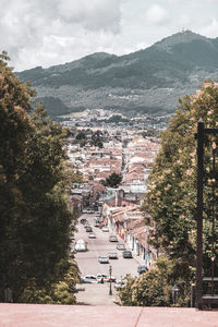 High angle view of townscape by road against sky