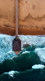 Aerial view of house on shore at beach