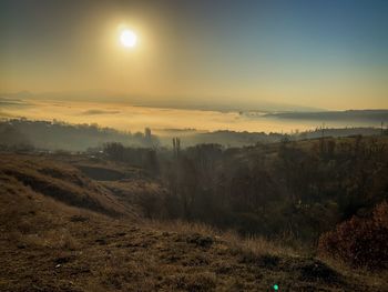 Scenic view of landscape against sky during sunset