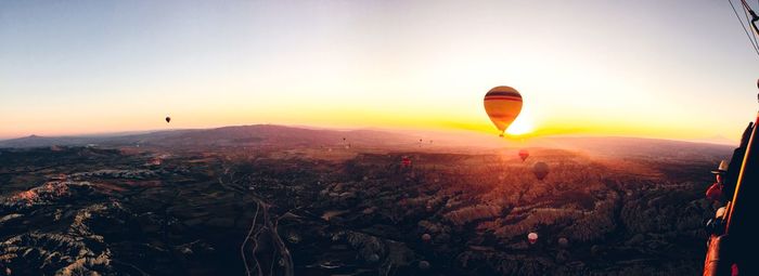 Aerial view of hot air balloons and landscape