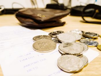 High angle view of coins on table
