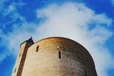 Low angle view of historic tower against sky