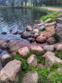 Stones on rocks by lake