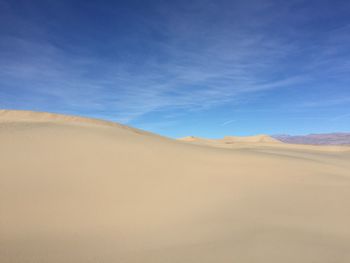 Scenic view of mesquite flat dunes against sky