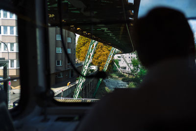 Close-up of man on car window