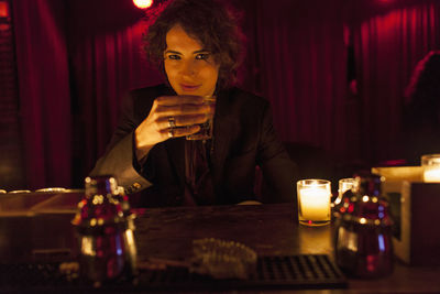 Woman enjoying a drink at a bar