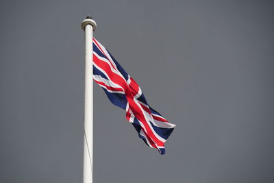 Low angle view of flag against sky