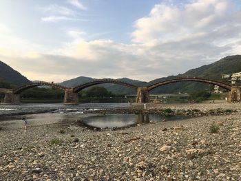 Bridge over river against sky
