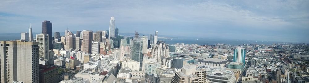 High angle view of modern buildings in city against sky