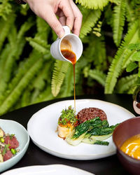 Close-up of hand holding plant