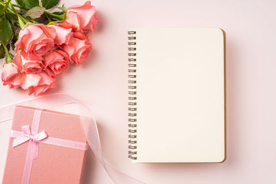 High angle view of pink roses on table