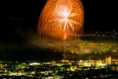 Firework display at night