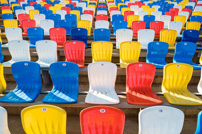 Multi colored chairs in row