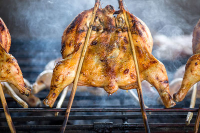 Close-up of meat on barbecue grill