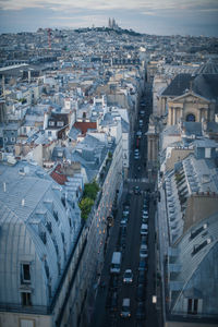 High angle view of traffic on street amidst buildings in city