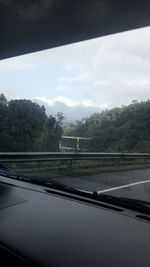 Road seen through car window