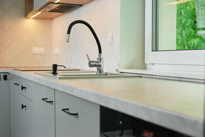 Modern kitchen interior with cabinets and empty countertop