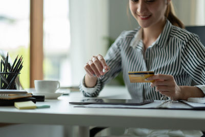 Businesswoman working at table