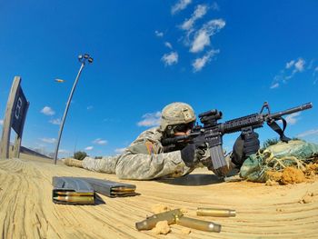 Silhouette of woman against blue sky