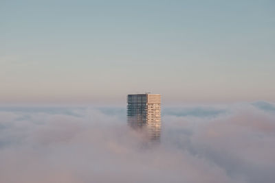 Low angle view of modern buildings against sky during sunset