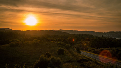 Scenic view of dramatic sky during sunset