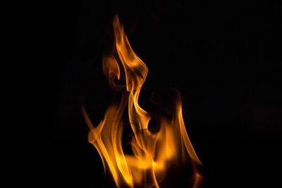 Close-up of fire against black background