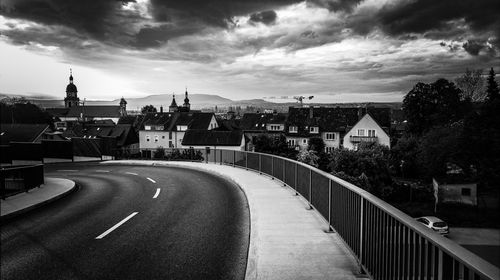 Road in city against sky