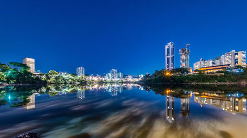 Reflection of illuminated buildings in water at night