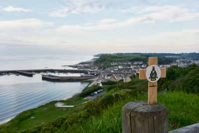 View of scenic village at the sea  arromanches-les-bains and remembrance cross in normandy france