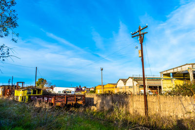 Train on grass against blue sky