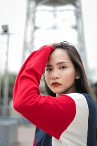 Portrait of beautiful young woman standing outdoors