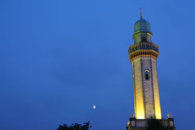 Low angle view of tower against clear blue sky