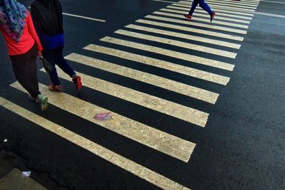 Low section of people on zebra crossing