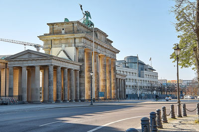 View of buildings in city against clear sky