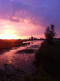 View of calm lake at sunset