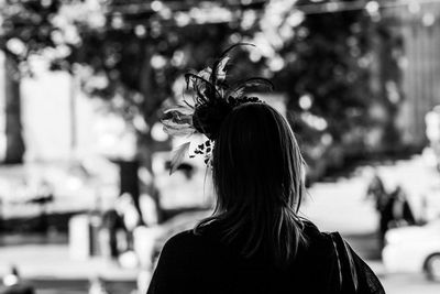 Rear view of woman standing outdoors