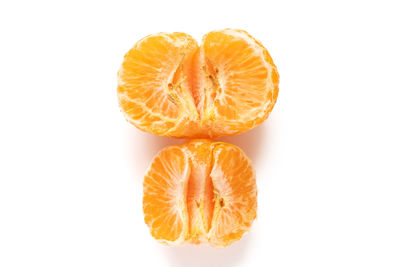 Close-up of orange slice against white background