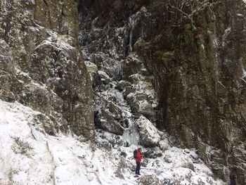 Man on snowcapped mountain during winter