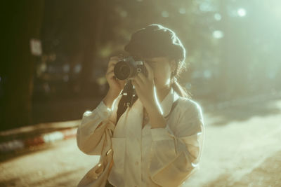 Woman photographing outdoors