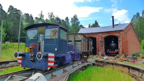 Train on railroad track against sky