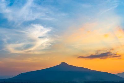 Scenic view of silhouette mountains against sky during sunset